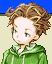 Portrait of Mewt: curly brown hair, a green hooded jacket