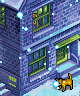 A brick house at night with a cat on the steps